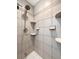 Shower stall with neutral tile, multiple shower shelves, and chrome shower head at 103 Beverly Dr, Ladson, SC 29456