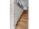 Carpeted staircase featuring a white railing and wainscoting at 103 Beverly Dr, Ladson, SC 29456