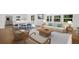 Bright living room with hardwood floors, lots of natural light, and modern furniture at 1031 Swamp Rose Run, Summerville, SC 29485