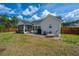Spacious backyard with well-maintained lawn, wooden fence, and patio furniture, ideal for outdoor living at 104 Cranston Ln, Summerville, SC 29483