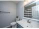 Clean bathroom featuring a white vanity with blue cabinets and a mirror, complementing the overall design at 104 Cranston Ln, Summerville, SC 29483