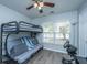 Comfortable bedroom with bunk bed, ceiling fan, and natural light at 104 Cranston Ln, Summerville, SC 29483