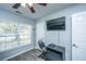 Bright bedroom with a ceiling fan, large window, and a modern gaming setup for entertainment at 104 Cranston Ln, Summerville, SC 29483
