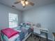 Cozy bedroom featuring a bed with patterned quilts and a small desk setup, perfect for work or study at 104 Cranston Ln, Summerville, SC 29483