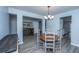 Charming dining room featuring a rustic table set, modern chandelier, and wood-look flooring at 104 Cranston Ln, Summerville, SC 29483