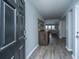 Inviting foyer with wood-look floors, a wooden cabinet, and an open view into the living area at 104 Cranston Ln, Summerville, SC 29483