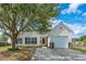 Charming single-story home with a well-maintained lawn, mature tree, and inviting curb appeal at 104 Cranston Ln, Summerville, SC 29483