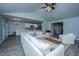 Open-concept living room features vaulted ceilings, modern furnishings, and seamless access to the kitchen at 104 Cranston Ln, Summerville, SC 29483
