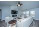 Bright and cozy living room with a vaulted ceiling, fireplace, and a large, comfortable sofa at 104 Cranston Ln, Summerville, SC 29483