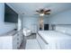 Bright main bedroom with white furnishings, fan, and decorative pillows and accents at 104 Cranston Ln, Summerville, SC 29483