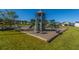 Community playground features multiple slides, climbing areas, and engineered wood fiber safety surfacing at 104 Cranston Ln, Summerville, SC 29483