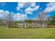 View of the community with pond surrounded by neighborhood homes at 104 Cranston Ln, Summerville, SC 29483