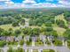 Stunning aerial view of the home nestled in a lush, green neighborhood near a golf course and pond at 105 N Gateshead Xing Xing, Goose Creek, SC 29445