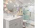 Elegant bathroom with a frameless glass shower, modern vanity, and a stylish round mirror at 105 N Gateshead Xing Xing, Goose Creek, SC 29445