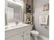 Chic bathroom with white vanity, decorative mirror and shelving niche next to toilet at 105 N Gateshead Xing Xing, Goose Creek, SC 29445