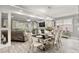 Elegant dining room with modern chandelier and an open view to living area at 105 N Gateshead Xing Xing, Goose Creek, SC 29445