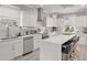 Bright kitchen with white cabinetry, stainless steel appliances, and large center island with bar stool seating at 105 N Gateshead Xing Xing, Goose Creek, SC 29445