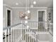 Bright, open landing features modern light fixtures and freshly painted gray walls at 105 N Gateshead Xing Xing, Goose Creek, SC 29445