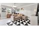 Inviting living room features a plush sofa, stylish decor, and a geometric-patterned rug at 105 N Gateshead Xing Xing, Goose Creek, SC 29445