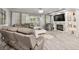 Spacious living room with cozy seating, fireplace, and sliding glass doors to the outside at 105 N Gateshead Xing Xing, Goose Creek, SC 29445