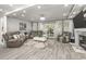 Large living room with comfortable seating, neutral decor, fireplace and sliding glass doors to the outside at 105 N Gateshead Xing Xing, Goose Creek, SC 29445
