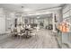 Open concept living and dining areas with modern fixtures, flowing into the living area at 105 N Gateshead Xing Xing, Goose Creek, SC 29445