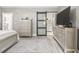 Tastefully furnished bedroom featuring a door to the main bathroom, a chest of drawers and decorative accents at 105 N Gateshead Xing Xing, Goose Creek, SC 29445