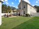 Large backyard with a patio, pergola, and plenty of green space for recreation at 113 Blackwater Way, Moncks Corner, SC 29461