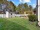Green backyard featuring a shed, lawn, and a patio with pergola at 113 Blackwater Way, Moncks Corner, SC 29461