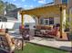 Outdoor patio area with fire pit, comfortable seating, and pergola at 113 Blackwater Way, Moncks Corner, SC 29461
