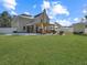 Expansive backyard with lush green grass, patio area, and privacy fence at 113 Blackwater Way, Moncks Corner, SC 29461