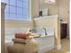 A close up of a soaking tub with adjacent fixtures and accessories in bright bathroom setting at 113 Blackwater Way, Moncks Corner, SC 29461