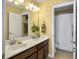 Bright bathroom with double sink vanity, decorative light fixture, and tiled flooring at 113 Blackwater Way, Moncks Corner, SC 29461