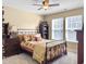 Spacious bedroom with ceiling fan, two large windows, and a cozy bed setting at 113 Blackwater Way, Moncks Corner, SC 29461