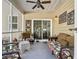 Outdoor patio with comfortable furniture and overhead fan for warm days at 113 Blackwater Way, Moncks Corner, SC 29461