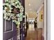Welcoming entryway with wreath and view through to the bright living area at 113 Blackwater Way, Moncks Corner, SC 29461