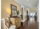 Inviting hallway with elegant decor and polished wood floors, leading to the main living areas at 113 Blackwater Way, Moncks Corner, SC 29461