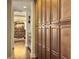 Hallway view with pantry and glimpse of a home office with unique lighting and wooden features at 113 Blackwater Way, Moncks Corner, SC 29461
