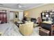 Well-decorated living room with ample seating, desk area, and bright natural light at 113 Blackwater Way, Moncks Corner, SC 29461