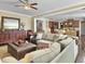 Open living room area with comfortable seating, view into kitchen, and elegant decor at 113 Blackwater Way, Moncks Corner, SC 29461
