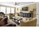 Inviting living room with comfortable seating, TV, and large windows at 113 Blackwater Way, Moncks Corner, SC 29461