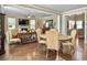 Cozy living room and dining area with hardwood floors, fireplace, and plenty of natural light at 113 Blackwater Way, Moncks Corner, SC 29461