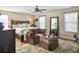 Well-lit main bedroom with a king-size bed, ceiling fan and comfortable seating at 113 Blackwater Way, Moncks Corner, SC 29461