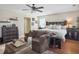 Bright main bedroom showcasing a cozy seating area and a king-sized bed at 113 Blackwater Way, Moncks Corner, SC 29461