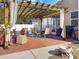 Covered patio with dining and lounge seating areas, perfect for outdoor entertaining at 113 Blackwater Way, Moncks Corner, SC 29461