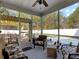 Cozy screened-in porch with comfortable seating, leading to an outdoor patio at 113 Blackwater Way, Moncks Corner, SC 29461