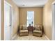 Cozy sitting area featuring two chairs, a side table, and a bright window at 113 Blackwater Way, Moncks Corner, SC 29461