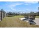A large backyard with a trampoline and patio set provides ample space for outdoor entertaining and recreation at 1132 Mossy Rock Dr, Summerville, SC 29485