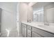 Bathroom with a double sink vanity, large mirror, and a glass-enclosed shower at 1132 Mossy Rock Dr, Summerville, SC 29485