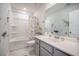 A bathroom with dinosaur decorations, white vanity, and shower with dinosaur shower curtain at 1132 Mossy Rock Dr, Summerville, SC 29485